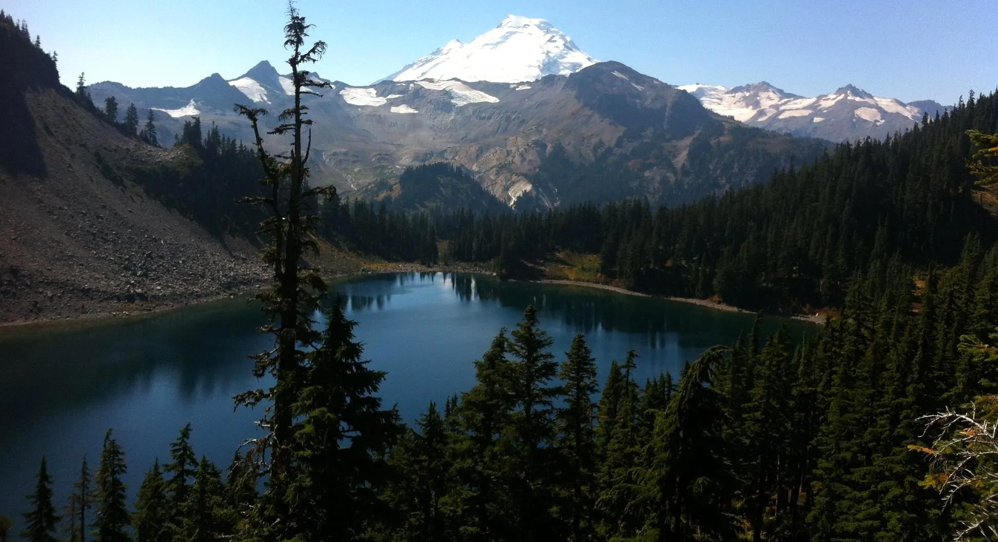 Iceberg Lake on the Chain Lakes Loop below Table Mountain with Mount Baker beyond the basin