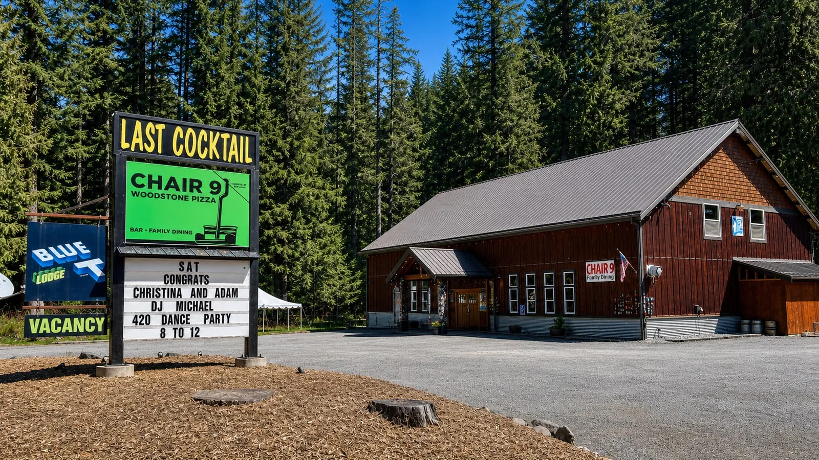 Chair 9 Woodstone Pizza’s roadside sign and timber restaurant in Glacier, Washington