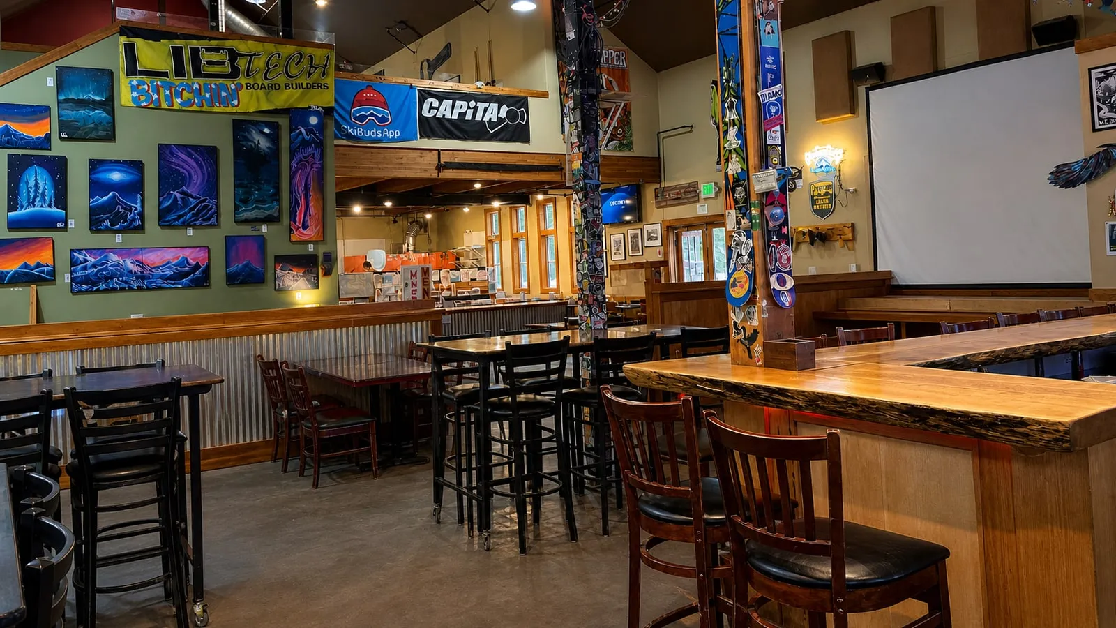 Chair 9’s empty dining room and bar with Mt. Baker art and snowboards on the walls
