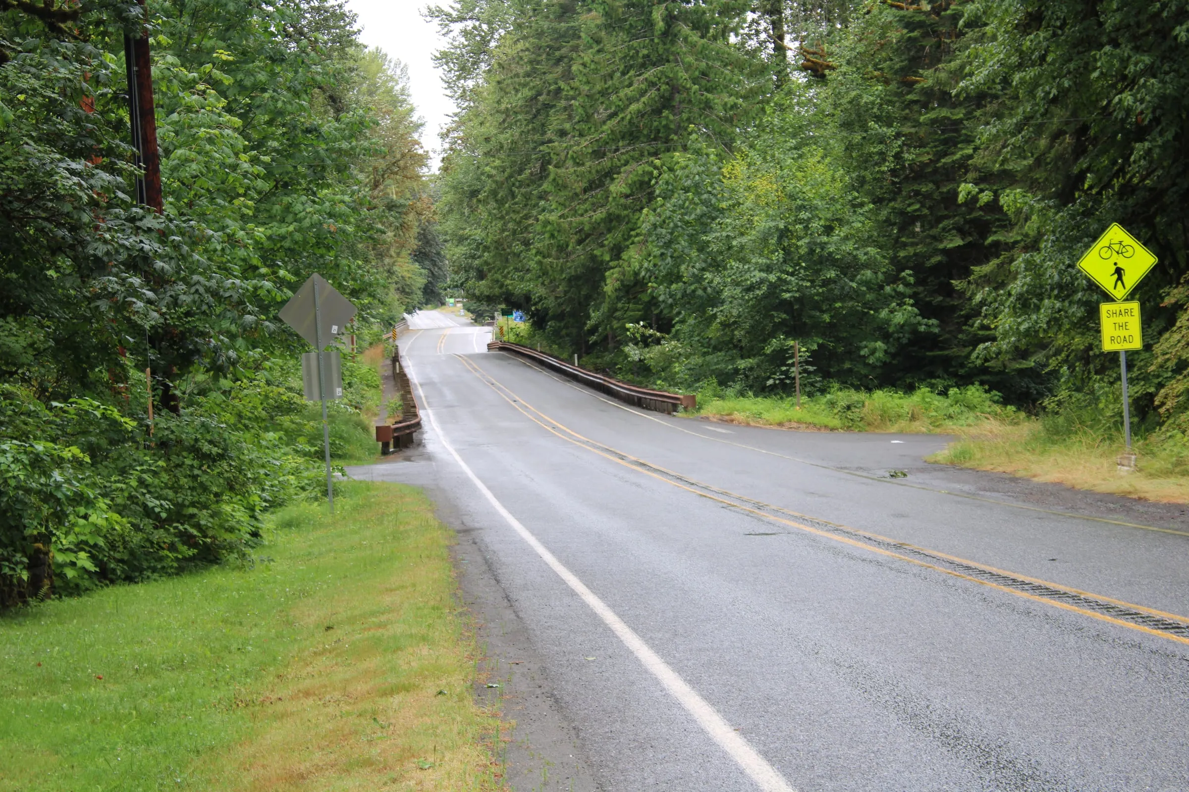 The Mt. Baker Highway approaching the town of Glacier, Washington on a wet summer day