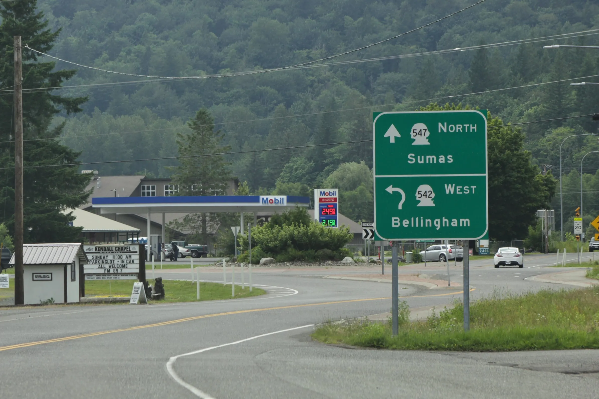 The junction of SR 542 and SR 547 at Kendall, Washington, with a highway sign pointing north to Sumas and west to Bellingham