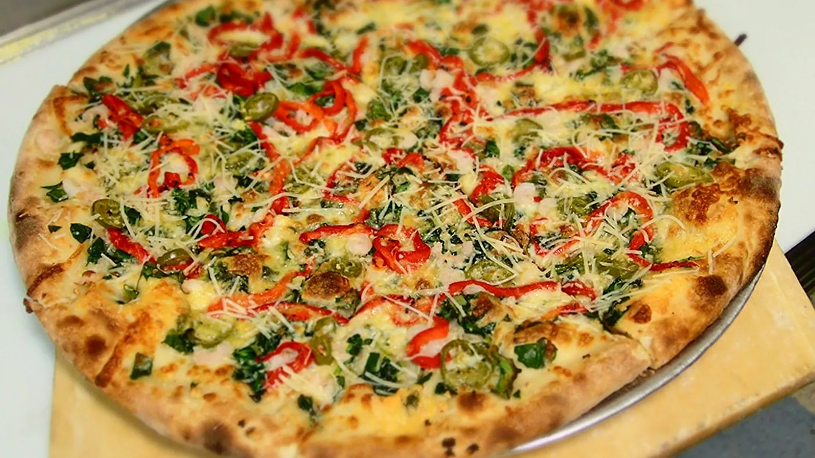 A Baja pizza with peppers, greens and cheese from North Fork Brewery