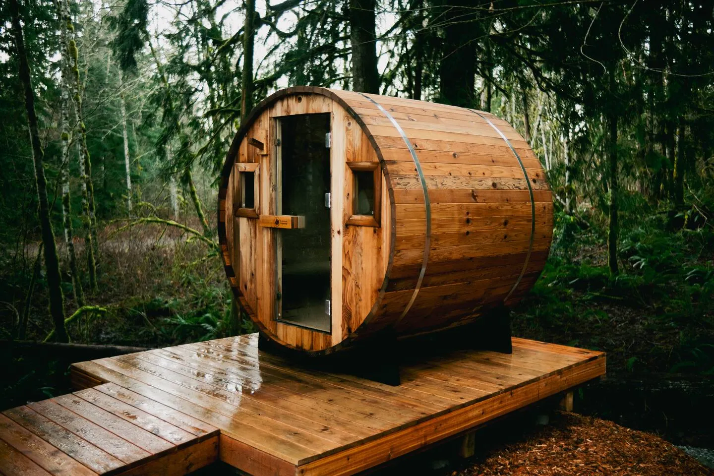 Cedar barrel sauna nestled in the forest