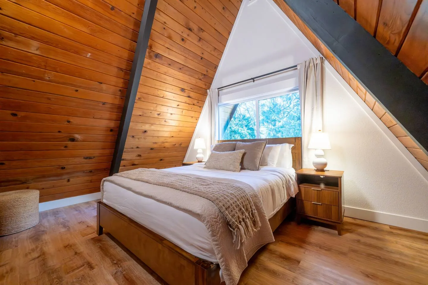 Queen bedroom under the A-frame roofline