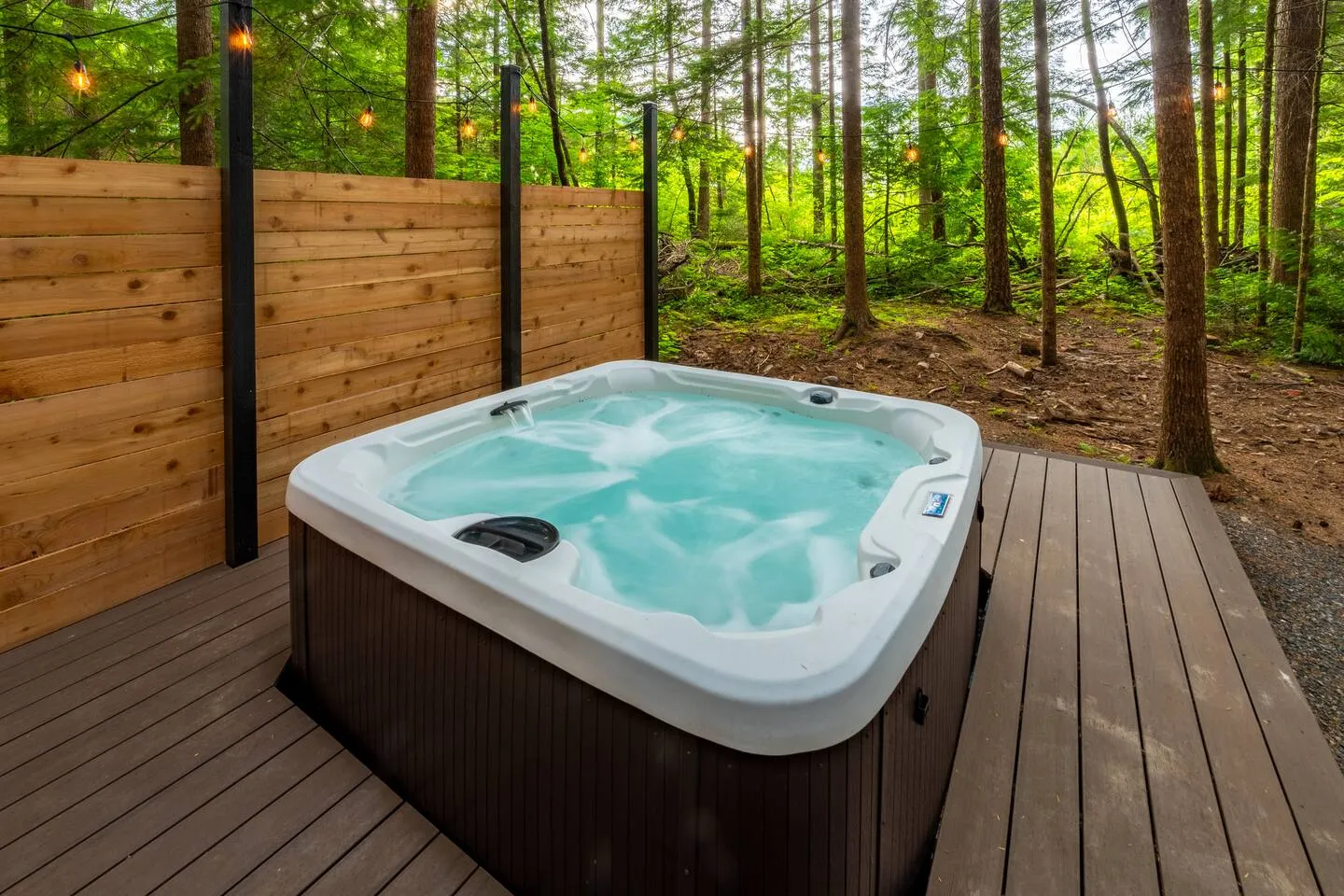 Private hot tub on the deck with cedar privacy wall