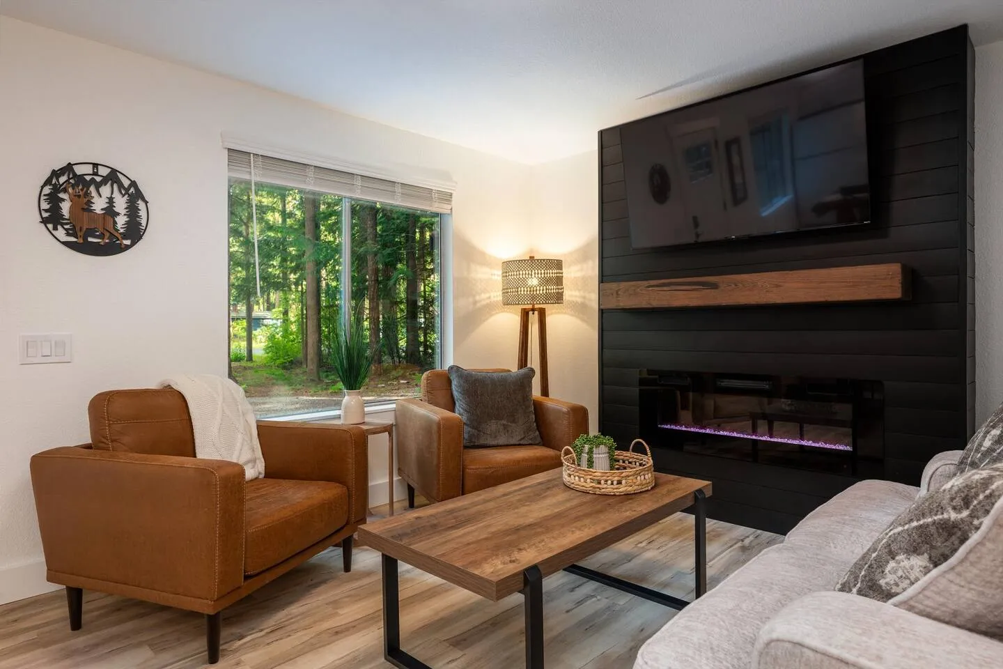 Living room with electric fireplace and leather seating