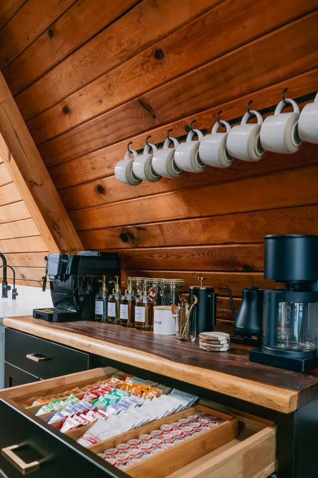 Espresso and hot cocoa bar with hanging mugs