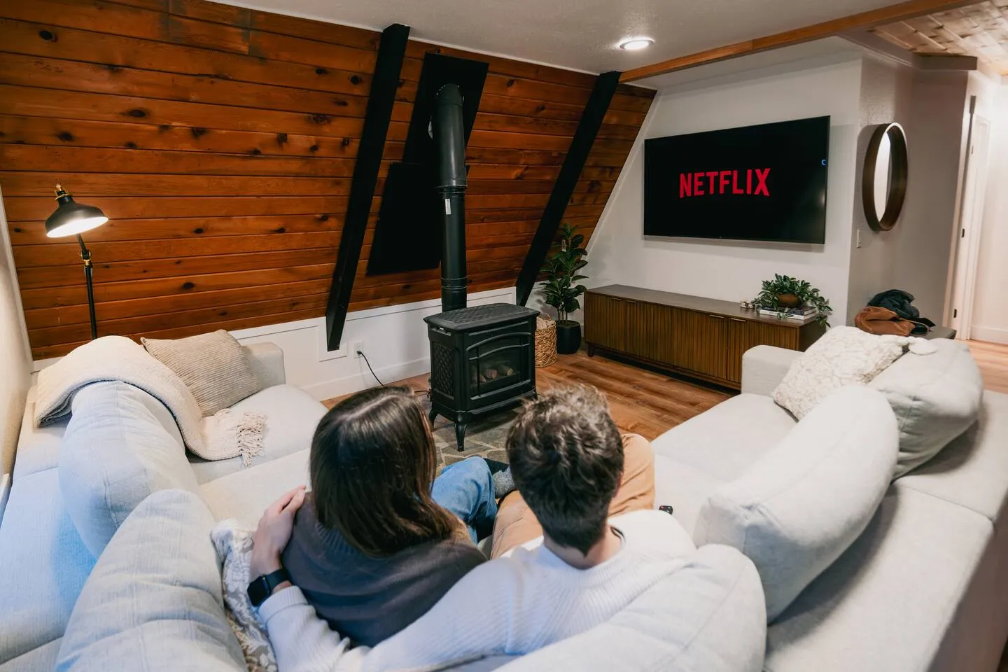 Living room with big sectional and Netflix on the TV