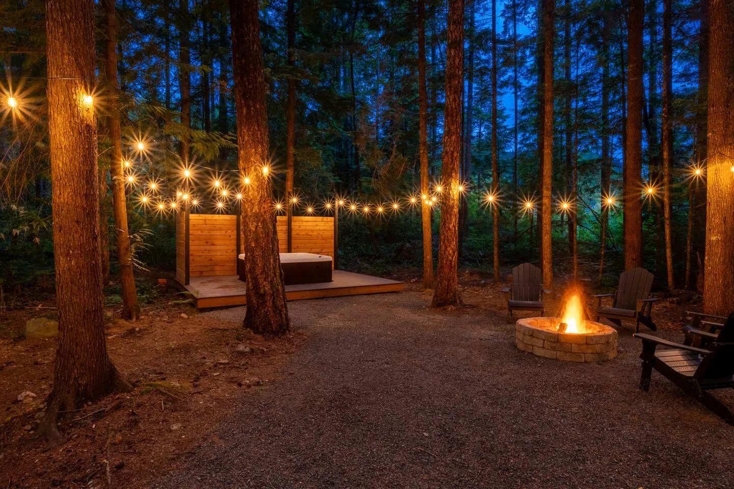 Hot tub under string lights at twilight