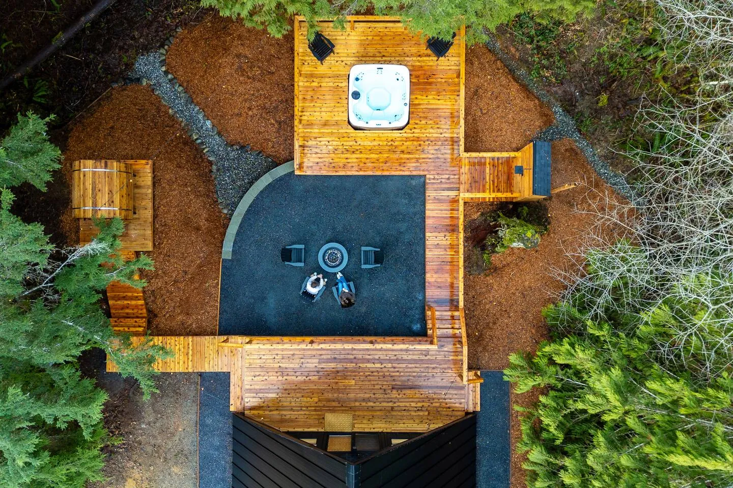 Aerial view of the A-frame deck, hot tub, and fire pit