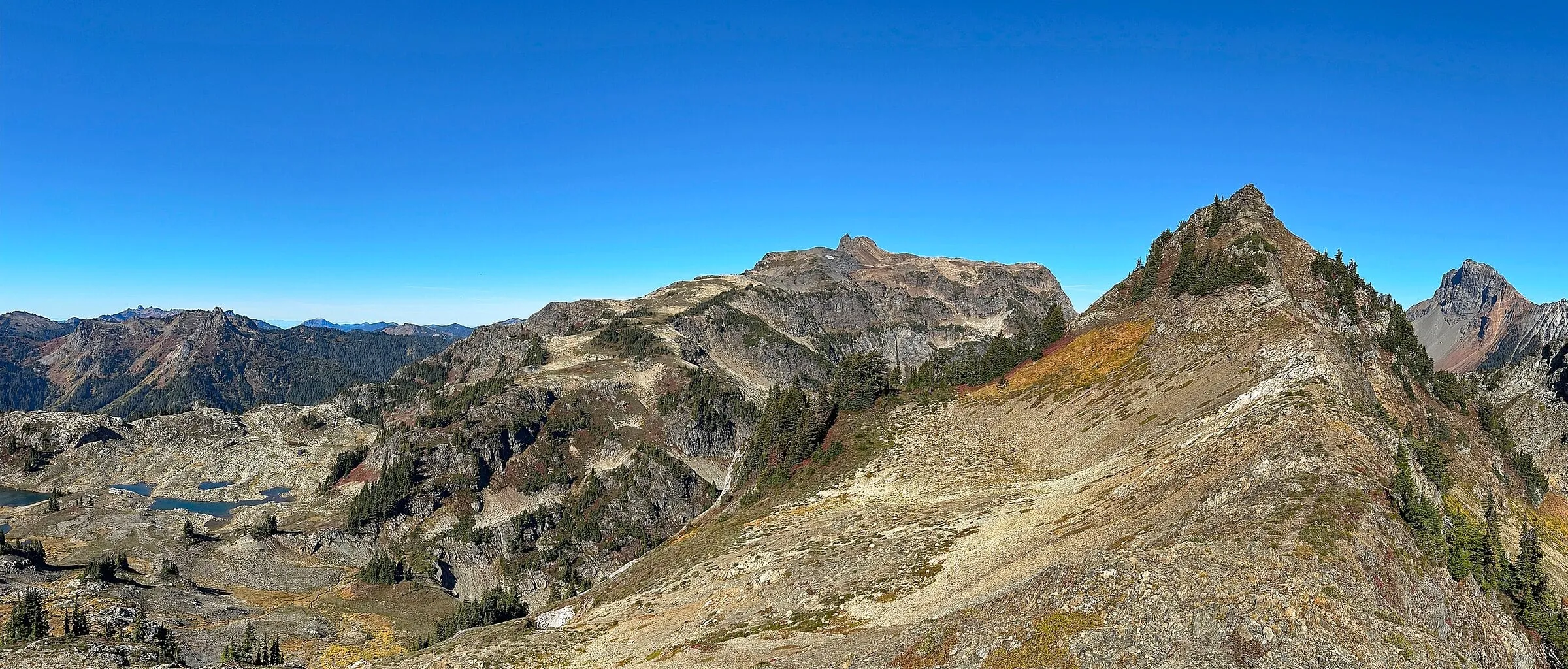 Yellow Aster Butte tarns and alpine slopes in autumn color in the North Cascades